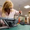 Mitre trimmer in use Mitre Trimmer / Moulding Guillotine