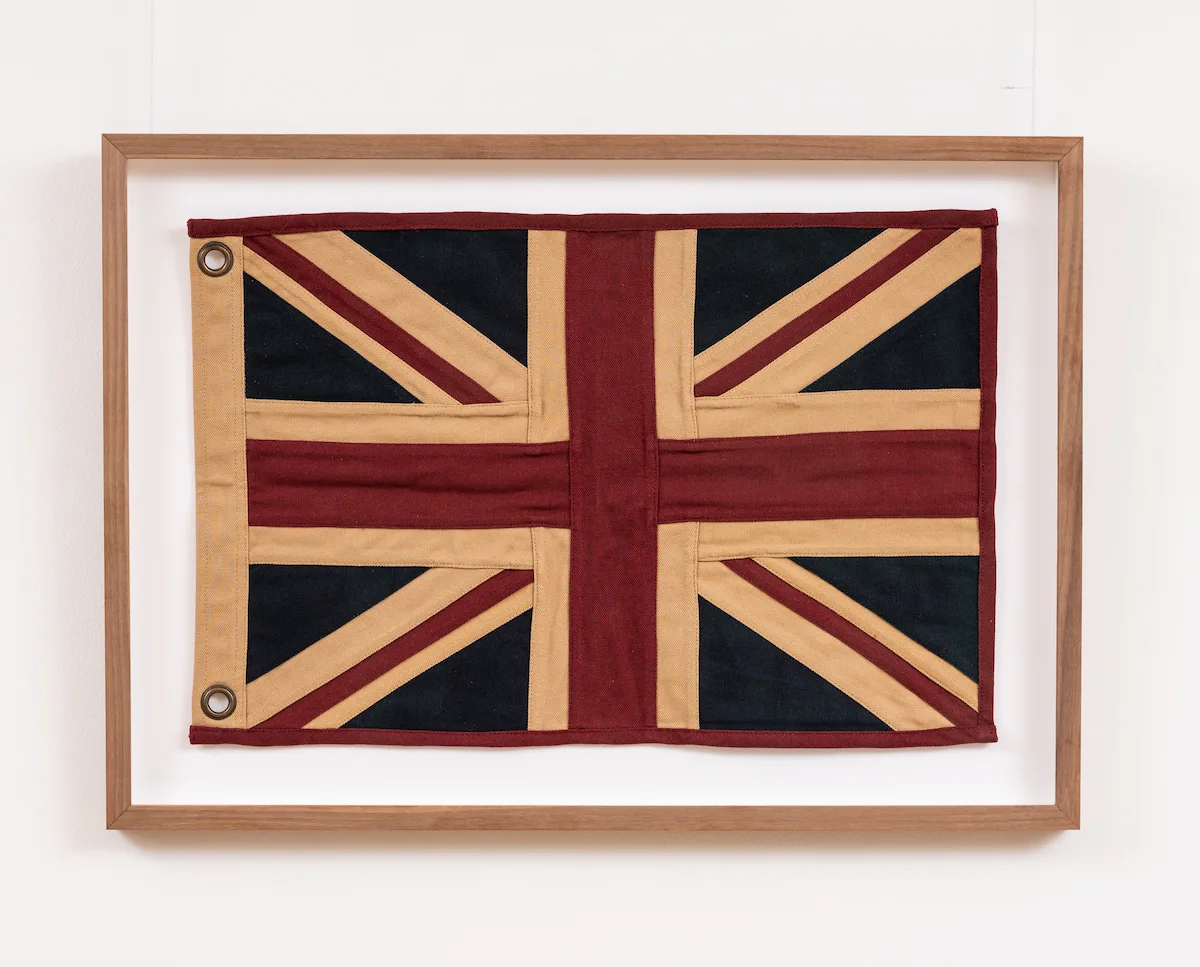 A framed textile flag