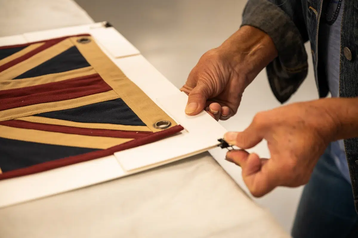textile & fabric framing preperation on a fabric flag.
