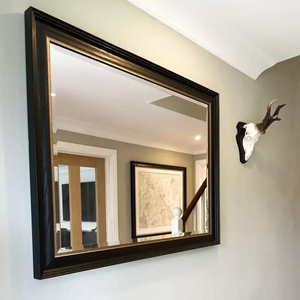A mirror that has been fitted into a frame