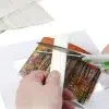 Lineco archival see thru strips 1585 action shot 2 Lineco See Thru Archival Mounting Strips 100mm - 60 Pack
